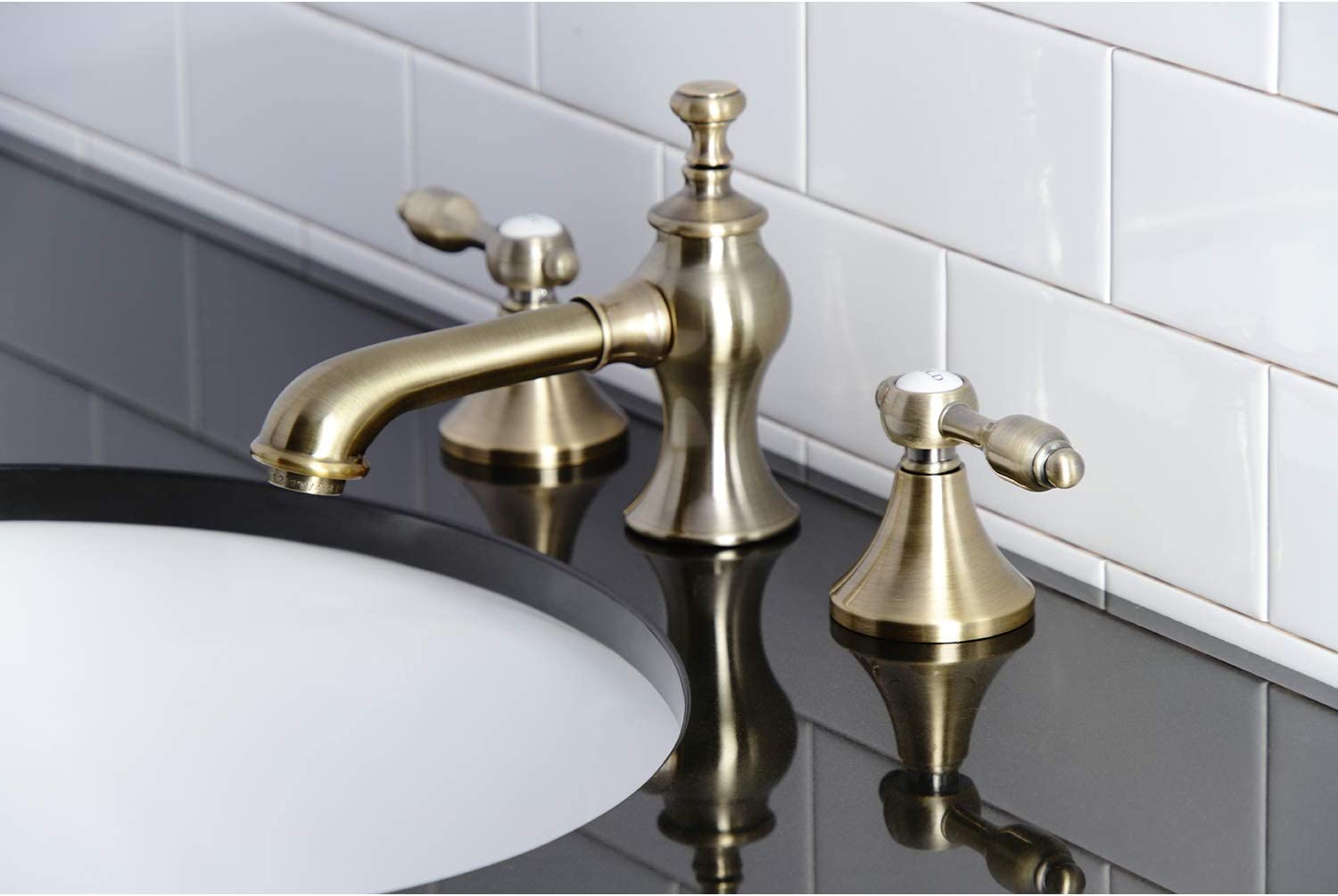 Kingston Brass KC7063TAL Tudor 8 in. Widespread Bathroom Faucet, Antique Brass