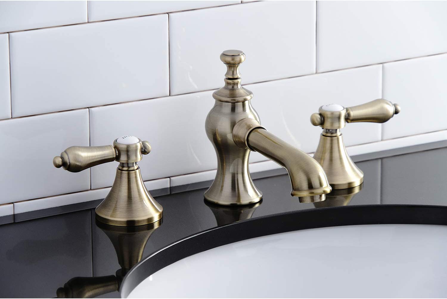 Kingston Brass KC7063BAL Heirloom 8 in. Widespread Bathroom Faucet, Antique Brass