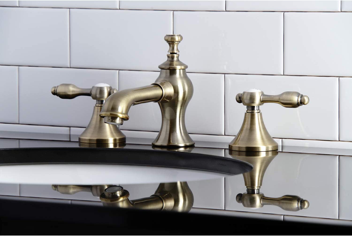 Kingston Brass KC7063TAL Tudor 8 in. Widespread Bathroom Faucet, Antique Brass