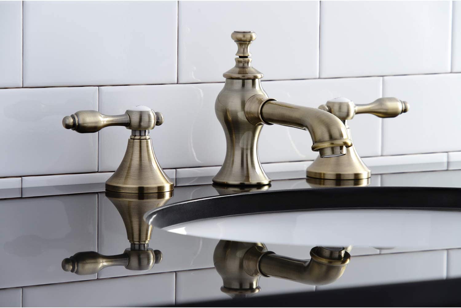 Kingston Brass KC7063TAL Tudor 8 in. Widespread Bathroom Faucet, Antique Brass