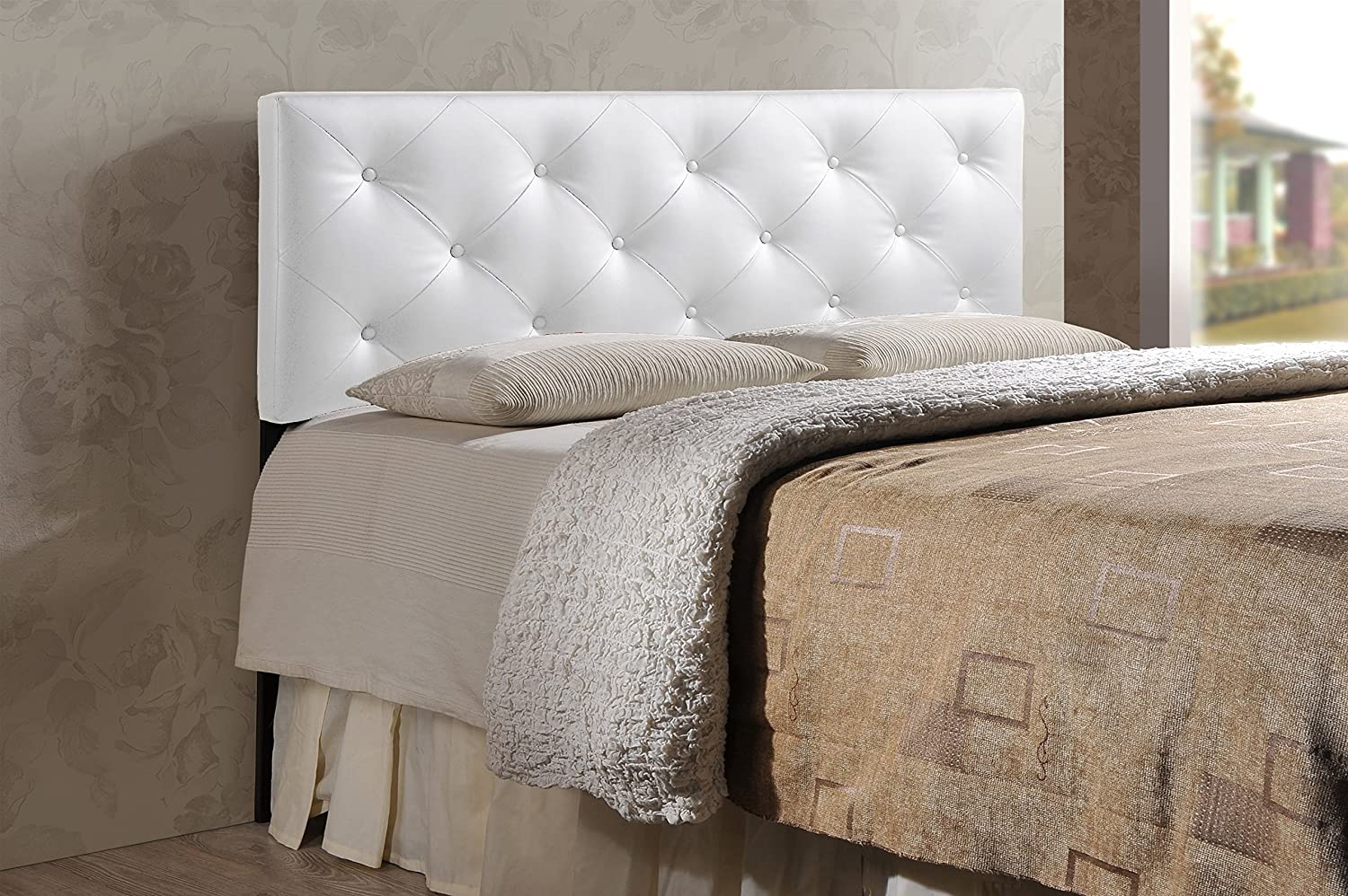 Bored with your bedroom. Need to perk up that platform bed Add the look of leather. Our king size white faux leather headboard boasts button-tufted distinction that contrasts sharply with just about any wall. Rubberwood frame with foam padding provides a